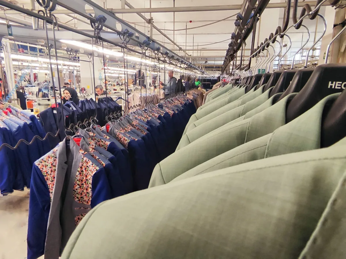 Erkon Tekstil factory with garment production lines and hanging garments